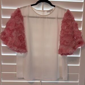 Top with mesh rosette sleeves.